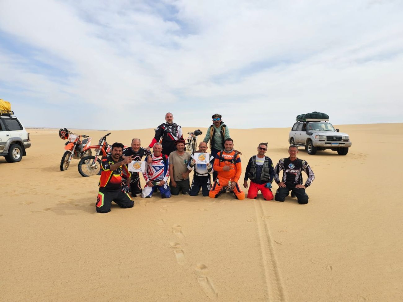 Travelers on motorbikes in the open desert