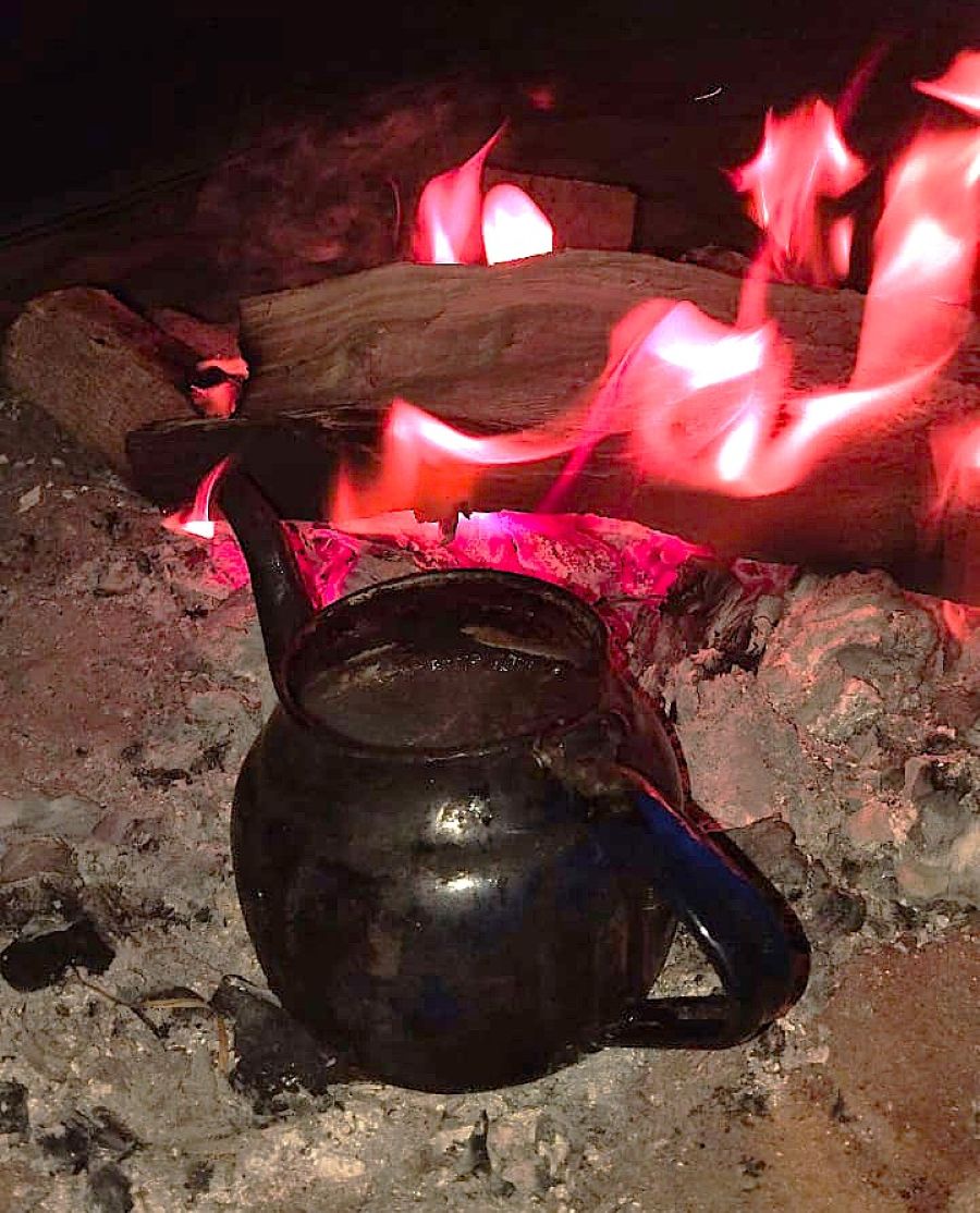 Bedouin tea brewing on coals